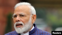 FILE PHOTO: India's Prime Minister Narendra Modi speaks to the media inside the parliament premises on the first day of the winter session in New Delhi, India, November 18, 2019. REUTERS/Altaf Hussain/File Photo