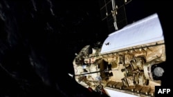 This handout photograph taken and released by the Russian Space Agency Roscosmos on July 29, 2021, shows the Russian Multipurpose Laboratory Module "Nauka" (Science) docking to the International Space Station (ISS). (Photo by Oleg NOVITSKY / Russian…