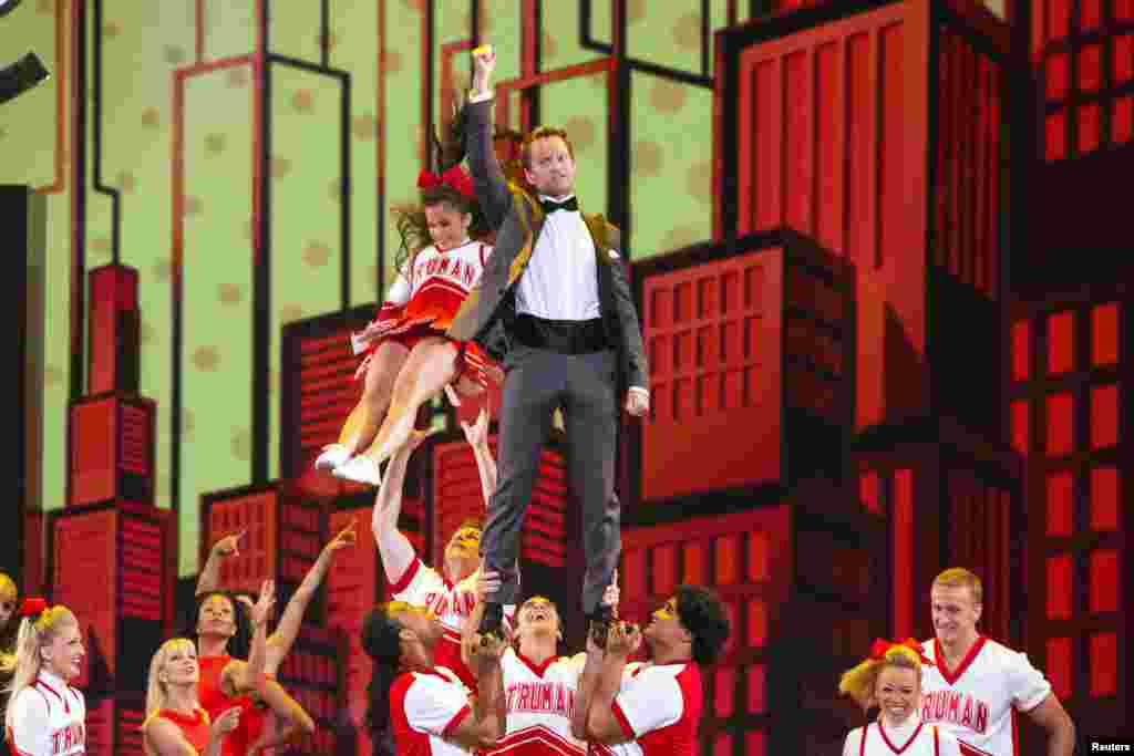 Actor Neil Patrick Harris performs with the cast of the musical "Bring it On" as he hosts the Tony Awards in New York, June 9, 2013.