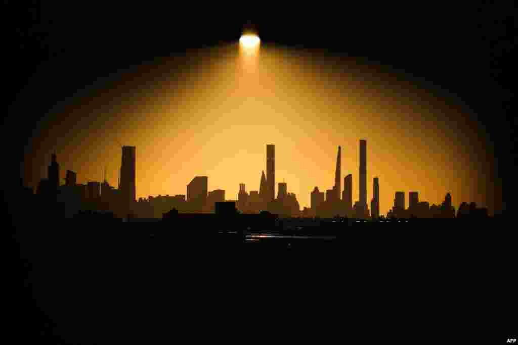 The Manhattan skyline is seen at sunset from Louis Armstrong Stadium during the U.S. Open tennis tournament at the USTA Billie Jean King National Tennis Center in New York City, Sept. 2, 2024.