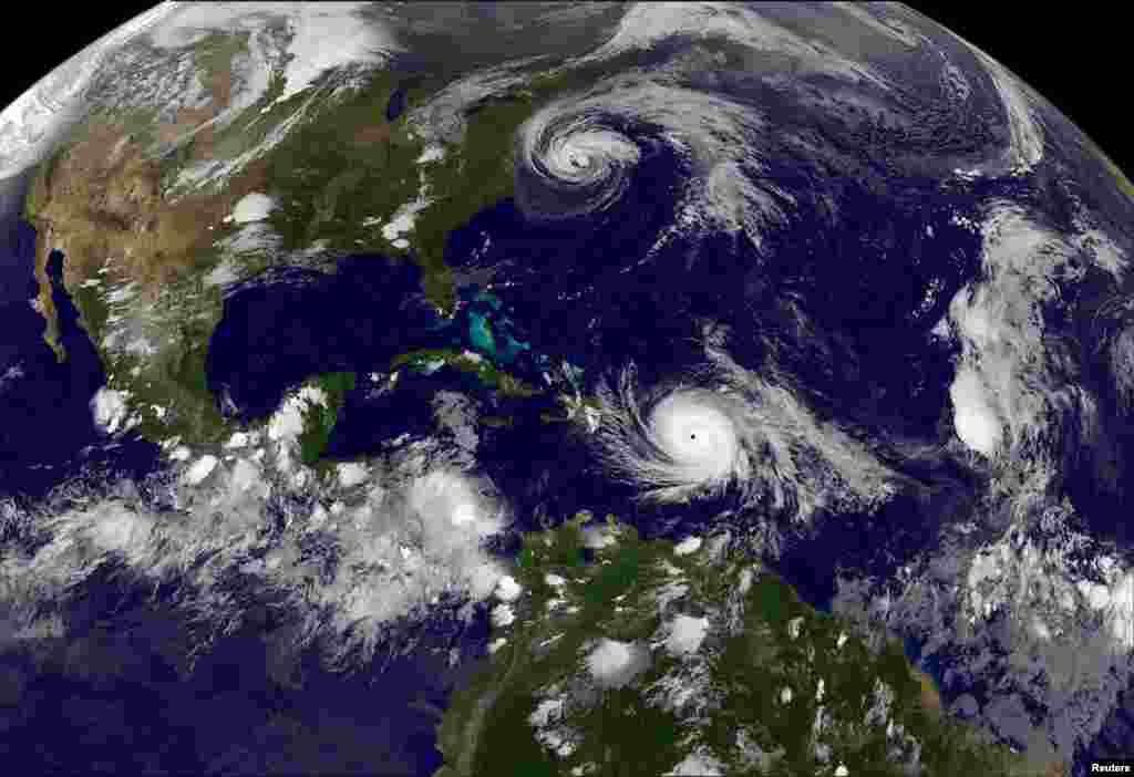 Hurricane Maria strikes the Virgin Islands and Puerto Rico on Tuesday after devastating the tiny island nation of Dominica and Hurricane Jose (top) seen in the Atlantic Ocean in this NOAA's GOES East satellite image taken at 21:45 EDT on September 19.