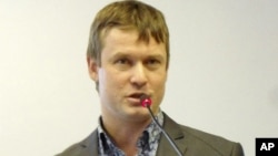 This undated photo shows Leonid Razvozzhayev speaking in an undisclosed location and is provided by the Assocoated Press Television News, October 22, 2012. 