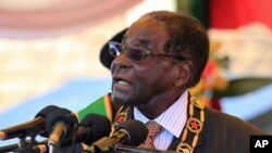 FILE - Zimbabwean President Robert Mugabe is seen delivering a speech in Harare, Aug. 10, 2015.