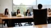 FILE - Students attend a meeting of a Chinese scholars association on the campus of the University of Connecticut in Storrs. 