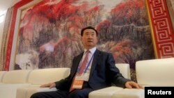 Wang Jianlin, chairman of Chinese property developer Dalian Wanda Group, sits in a meeting room as he arrives for the launch ceremony for the Qingdao Oriental Movie Metropolis on the outskirts of Qingdao.