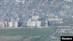 Smoke erupts following a shell explosion in Bakhmut