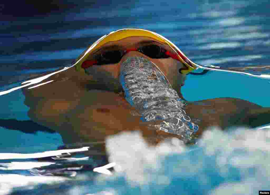 Xu Jiayu of China competes in the men's 50m backstroke heats swimming event during the 2018 Asian Games in Jakarta, Indonesia.