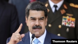 FILE - Venezuela's President Nicolas Maduro holds a news conference at Miraflores Palace in Caracas in June 2020.