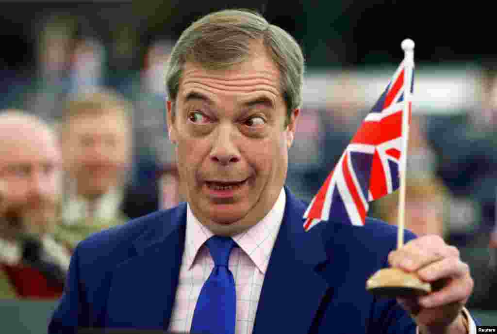 Brexit campaigner and Member of the European Parliament Nigel Farage holds a Union Jack flag during a debate on Brexit after the vote on British Prime Minister Theresa May's Brexit deal, at the European Parliament in Strasbourg, France.