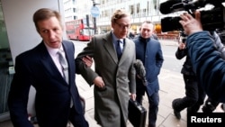 FILE - Alexander Nix, CEO of Cambridge Analytica arrives at the offices of Cambridge Analytica in central London, Britain, March 20, 2018. 