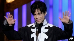 FILE - Prince accepts the award for outstanding male artist at the 38th NAACP Image Awards in this March 2, 2007 file photo, in Los Angeles.