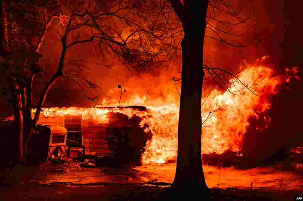 A home is engulfed in flames during the Eaton fire in Pasadena, California, Jan. 7, 2025.