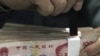 China Hopes Trade Deficit Will Slow Calls for Weaker Currency