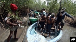 FILE - Militants from Nigeria's Delta region.