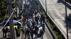 A group of Central American migrants resume their journey north toward the U.S. after leaving a temporary shelter in Mexico City, Mexico, Nov. 9, 2018.