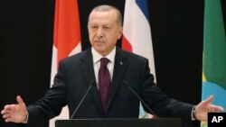 Turkey's President Recep Tayyip Erdogan delivers a speech during the Global Refugee Forum at the European headquarters of the United Nations in Geneva, Switzerland, Dec. 17, 2019. 