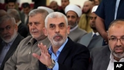 FILE - Yahya Sinwar greets supporters on the sea side of Gaza City, April 30, 2022. On Sept. 3, 2024, the U.S. Justice Department announced criminal charges against Sinwar and other senior militants in connection with the Oct. 7, 2023, rampage in Israel.