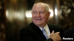FILE - Former Georgia governor Sonny Perdue arrives for a meeting with U.S. President-elect Donald Trump at Trump Tower in New York, Nov. 30, 2016. 