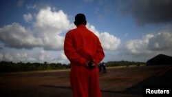 A Petrobras worker stands at the Oiapoque airport, near the mouth of the Amazon in Oiapoque, State of Amapa, Brazil, March 20, 2024. (REUTERS/Adriano Machado)

