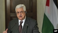 Palestinian President Mahmoud Abbas attends a news conference where he mentions the Mideast peace process, after his meeting with Greek Prime Minister George Papandreou at premier's office in Athens, Dec 8, 2010