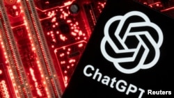 FILE - A smartphone with a displayed ChatGPT logo is placed on a computer motherboard in this illustration taken Feb. 23, 2023.