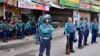 FILE - Police personnel stand guard in front of the Bangladesh Nationalist Party headquarters in Dhaka on Nov. 19, 2023, during a nationwide strike called by BNP activists. The party said about half of its five million members "face politically motivated prosecution."