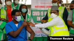 FILE - Dr. Ngong Cyprian gets a dose of COVID-19 vaccine at the National hospital in Abuja, Nigeria, March 5, 2021.