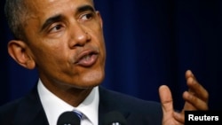 FILE - President Barack Obama speaks in Washington at the White House Summit on Countering Violent Extremism, Feb. 18, 2015.