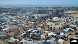An aerial picture shows displaced Palestinians who fled Khan Yunis setting up camp in Rafah further south near the Gaza Strip's border with Egypt, on December 7, 2023, amid continuing battles between Israel and the Palestinian militant group Hamas.