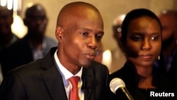 FILE - Jovenel Moise addresses the media next to his wife Martine after winning 55.67 percent of the vote in the Nov. 20 presidential election, according to the electoral council, in Port-au-Prince, Haiti, Nov. 28, 2016.