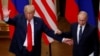 U.S. President Donald Trump and Russian President Vladimir Putin react at the end of the joint news conference after their meeting in Helsinki, Finland, July 16, 2018. 