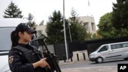 FILE - A special security force member stands guard near the U.S. Embassy in Ankara, Turkey, Oct. 8, 2019.