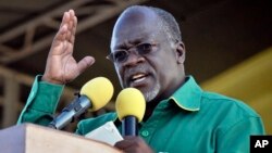 FILE - President John Pombe Magufu gestures, during a rally in Dar es Salaam, Tanzania, Oct. 23, 2015. 