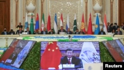 中國國家領導人習近平在塔吉克斯坦杜尚別舉行的上海合作組織峰會上通過視頻發表講話。 （2021年9月17日）