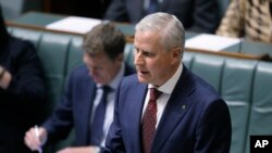 FILE - Australian Nationals party leader and Deputy Prime Minister Michael McCormack makes a speech in parliament in Canberra, Monday, Feb. 26, 2018. McCormack was appointed after his predecessor quit over a sexual harassment allegation.