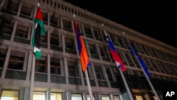 The Palestinian flag is raised in front of the Slovenian parliament building after the vote in Ljubljana, Slovenia, June 4, 2024. Slovenia recognized a Palestinian state on Tuesday after its parliament voted overwhelmingly in favor of the move,