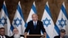 Perdana Menteri Israel Benjamin Netanyahu berbicara pada rapat kabinet mingguan di Kota Tua Yerusalem hari Minggu (21/5). 