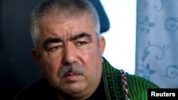 FILE - Abdul Rashid Dostum speaks during an interview in Shibergan, northern Afghanistan, Aug. 19, 2009. 