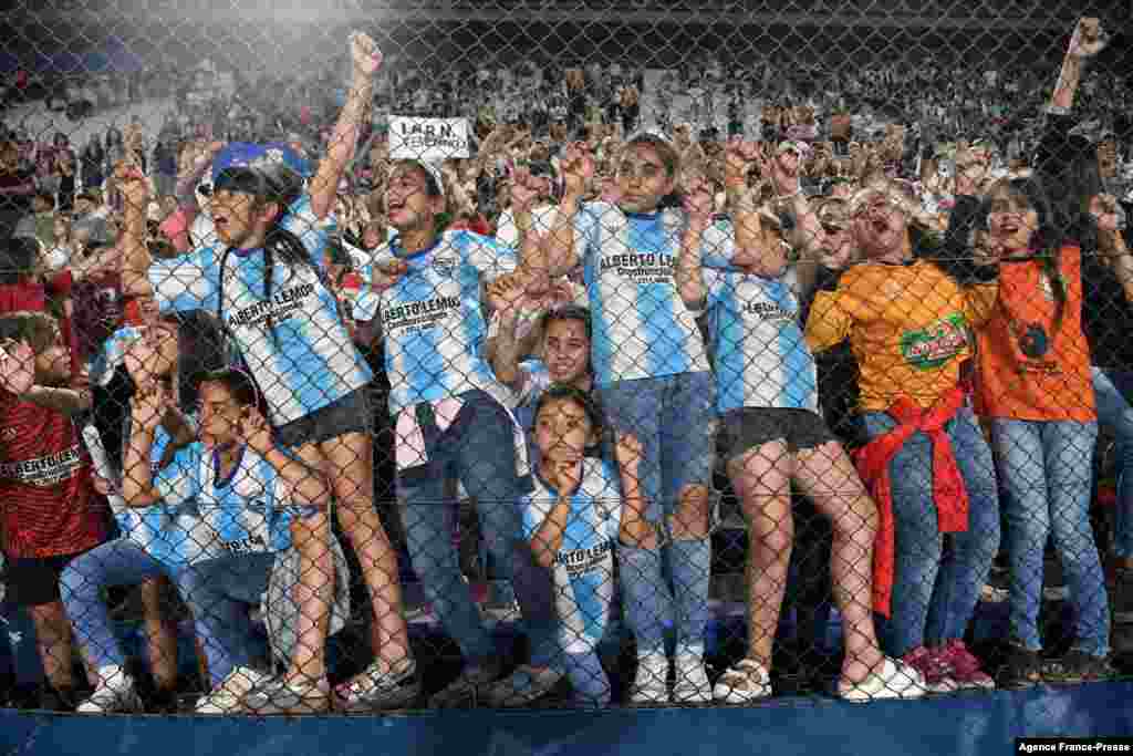A group of girls react after Brazil's Corinthians defeated Colombia's Santa Fe in the Women's Copa Libertadores final football match, on November 21, 2021 at the Gran Parque Central stadium in Montevideo.