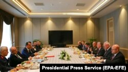 TURKEY -- U.S. National Security Adviser John Bolton and his Turkish counterpart Ibrahim Kalin are flanked by Turkish and U.S. officials as they meet at the Presidential Palace in Ankara, January 8, 2019 Photo: RSE/RL