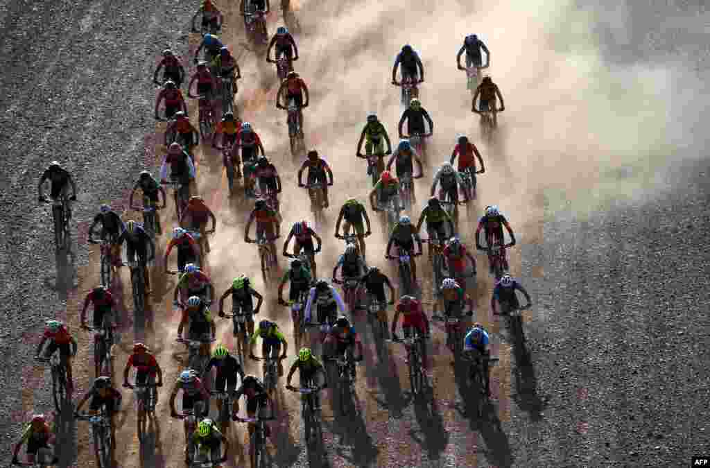 Competitors ride their bikes during Stage 4 of the 14th edition of Titan Desert 2019 mountain biking race between Merzouga and M’ssici, in Morocco.
