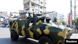 Myanmar Army armored vehicles drive in a street after the military seized power in a coup in Mandalay, Myanmar February 3, 2021. REUTERS/Stringer 