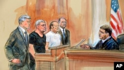 This courtroom sketch depicts from left, attorney Kevin Downing, Lev Parnas, Igor Fruman, and attorney Thomas Zehnle standing before U.S. Judge Michael Nachmanoff, at federal courthouse in Alexandria, Va., Oct. 10, 2019. 