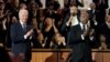 Presiden AS Joe Biden bersama Senator Raphael Warnock (kanan) disambut meriah oleh jemaat di Gereja Baptis Ebenezer di Atlanta, Georgia, pada hari peringatan Martin Luther King Jr. hari Minggu (15/1). 