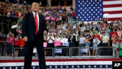 President Donald Trump arrives to speak at a campaign rally at Erie Insurance Arena, Oct. 10, 2018, in Erie, Pa. 