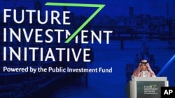 FILE - In this photo released by Saudi Press Agency, SPA, Saudi Minister of Commerce and Investment Majid al-Qasabi talks to the audience at the opening of Future Investment Initiative conference in Riyadh, Saudi Arabia, Oct. 24, 2017.