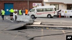 A paved road is lifted at the ports in Wellington, New Zealand, Nov. 14, 2016, following an earthquake.