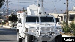 A UN peacekeepers (UNIFIL) vehicle drives in Marjayoun