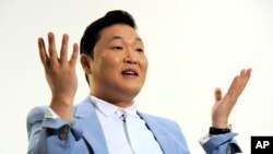 FILE - South Korean musical performer Psy speaks during an interview in Los Angeles.