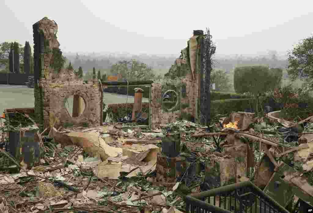 The remains of the Signorello Estate winery continue to smolder, Oct. 10, 2017, in Napa, California.